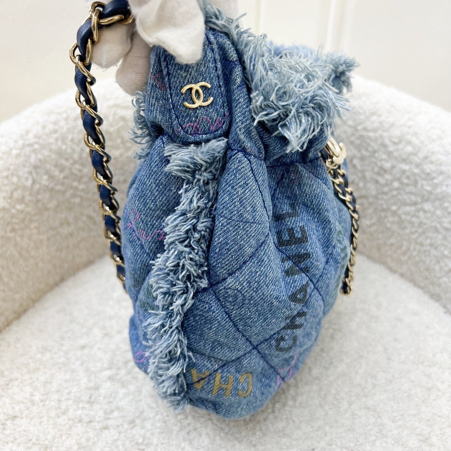 Chanel 22P Denim Mood Mini Drawstring Bucket Bag in Blue Printed Denim and LGHW