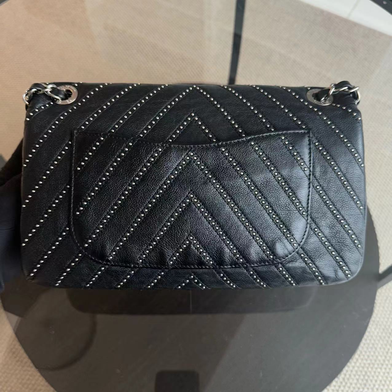 Chanel Seasonal Flap - Studded 25CM Chevron Calfskin Black Silver Hardware Series 24