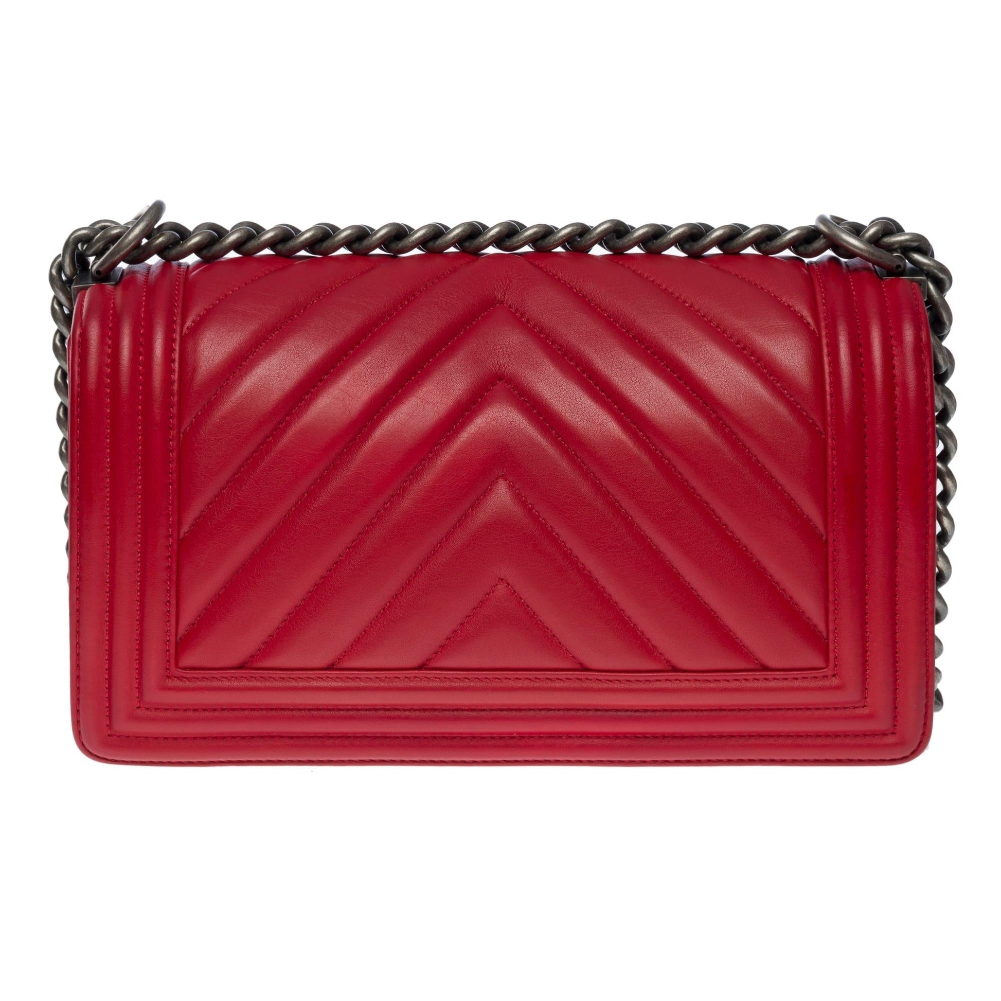 Chanel Boy Old Medium shoulder bag in red quilted herringbone leather, SHW
