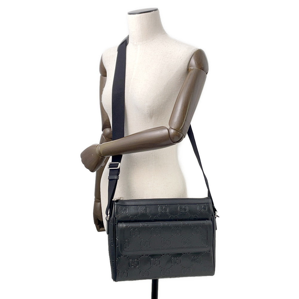 GUCCI GG-embossed messenger bag Black658565 Leather
