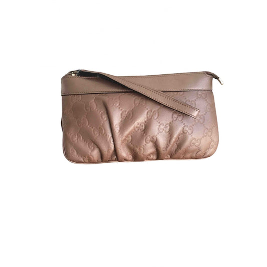 Gucci metallic leather clutch bag