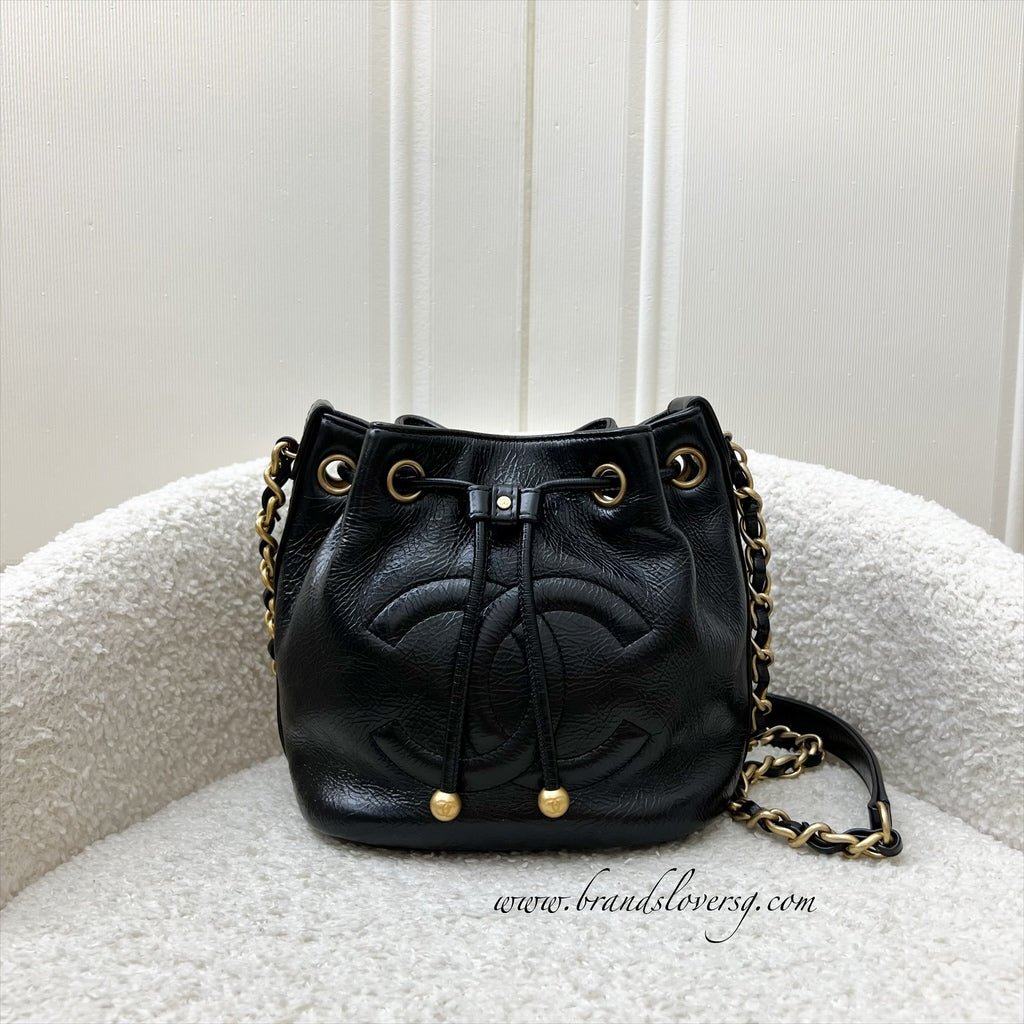 Chanel Mini Drawstring Bucket Bag in Glossy Distressed Black Calfskin and Aghw