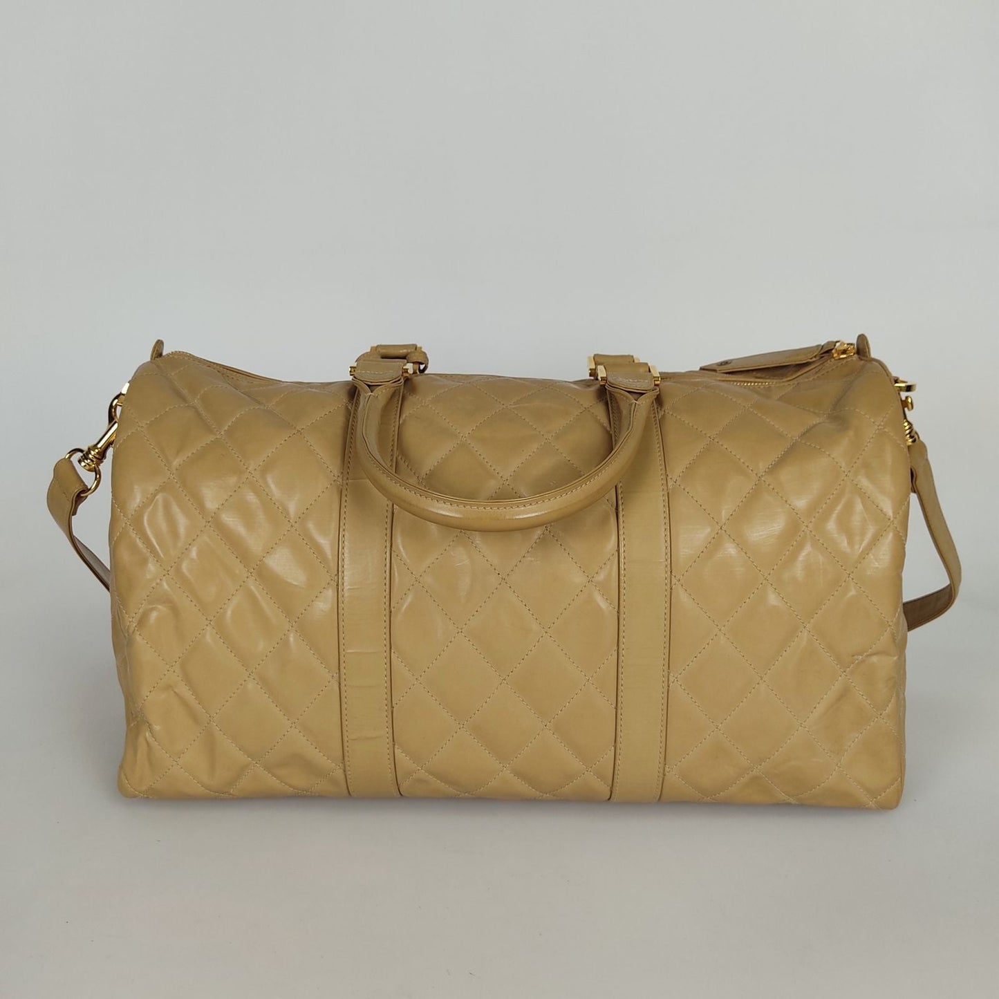 Chanel Chanel Chanel quilted travel bag in beige patent leather