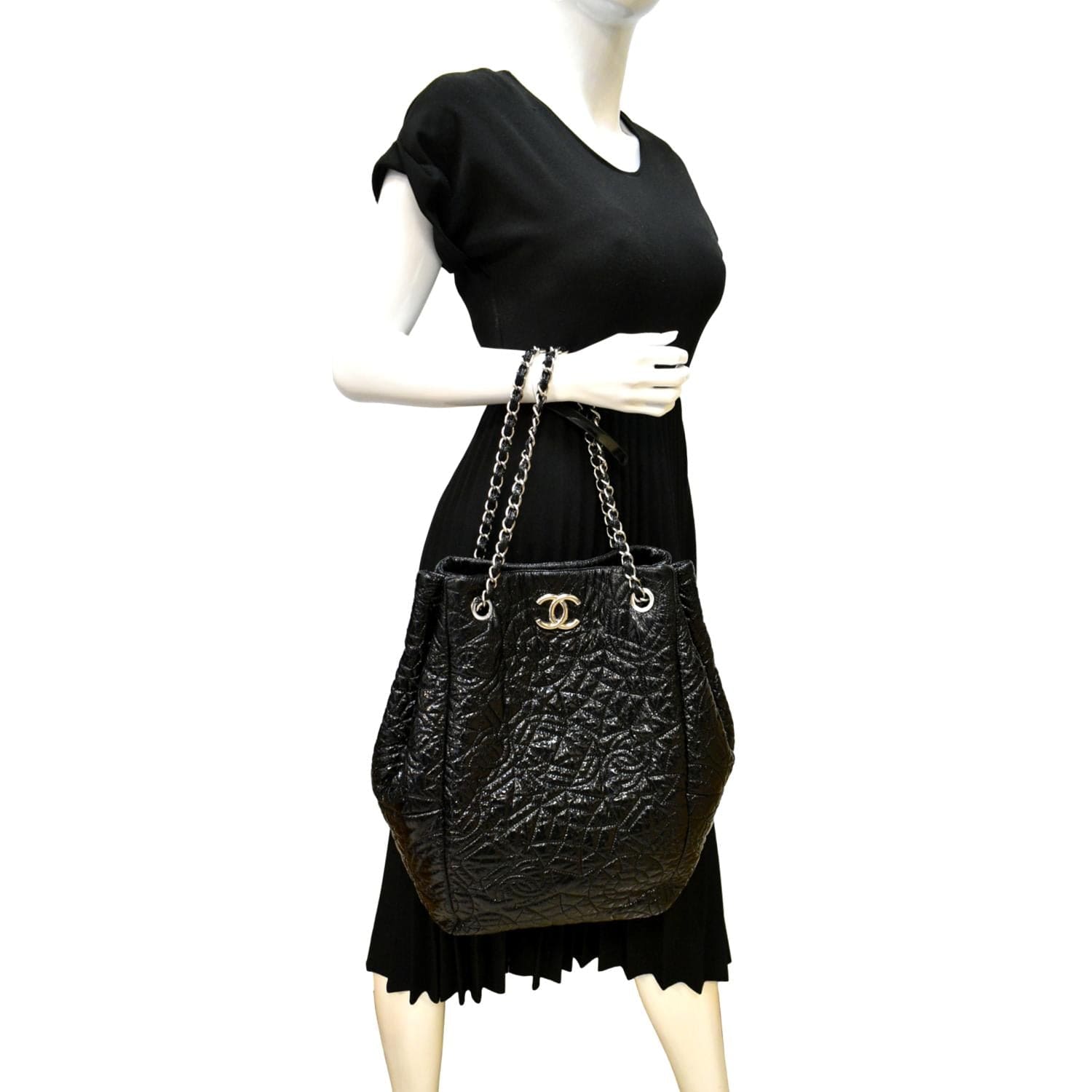 Chanel Camellia Embossed Vinyl Leather Black Travel Bag