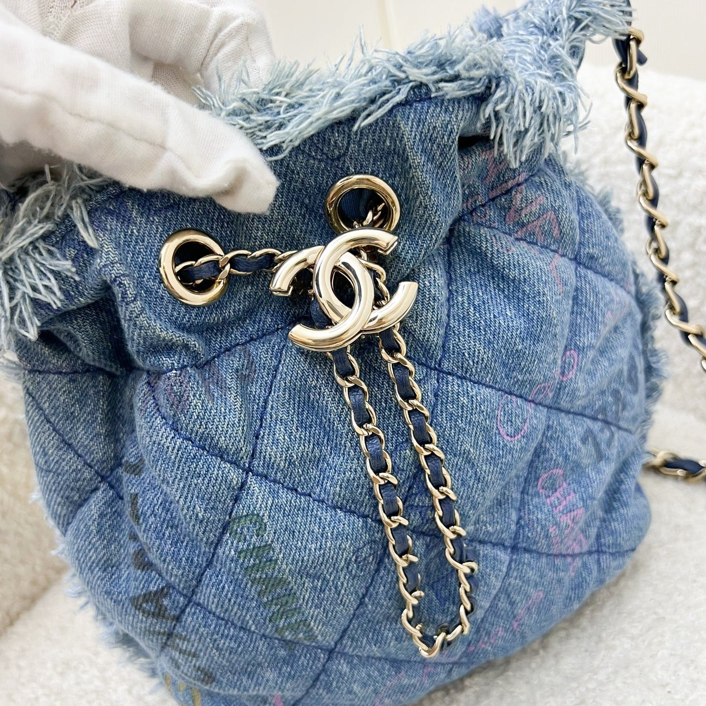 Chanel 22P Denim Mood Mini Drawstring Bucket Bag in Blue Printed Denim and LGHW