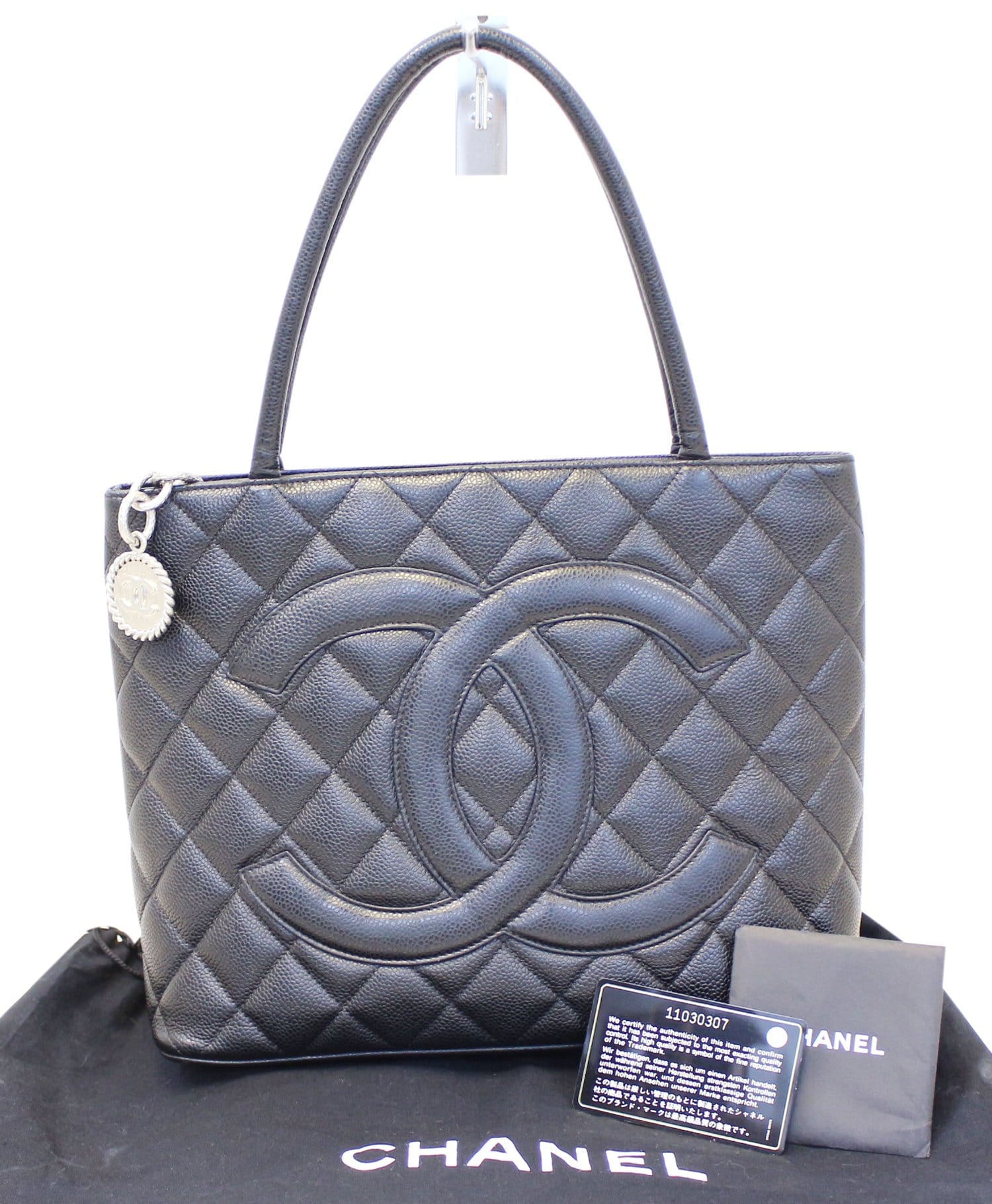 Chanel Quilted Caviar Medallion Leather Black Travel Bag