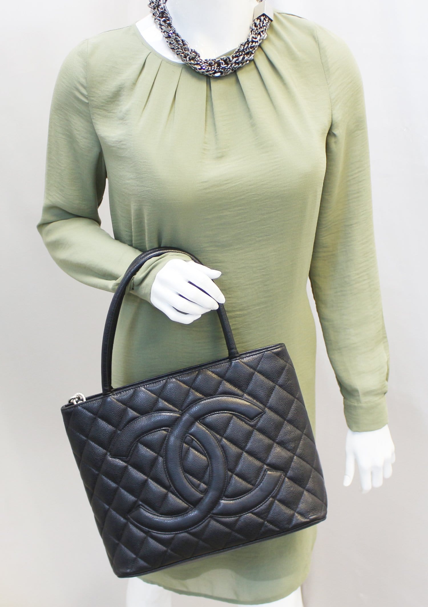 Chanel Quilted Caviar Medallion Leather Black Travel Bag