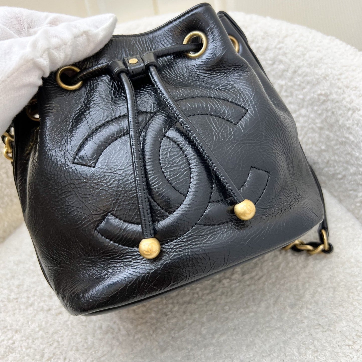 Chanel Mini Drawstring Bucket Bag In Glossy Distressed Black Calfskin And Aghw