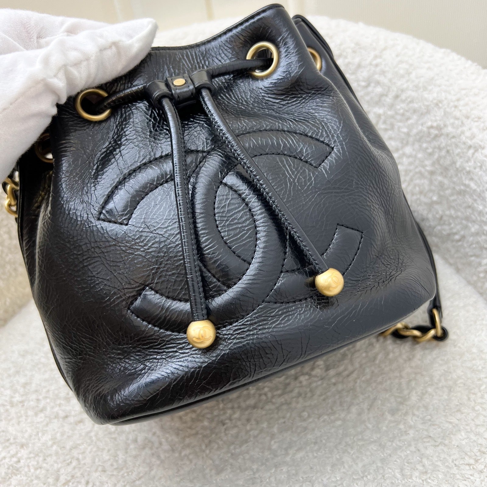 Chanel Mini Drawstring Bucket Bag In Glossy Distressed Black Calfskin And Aghw