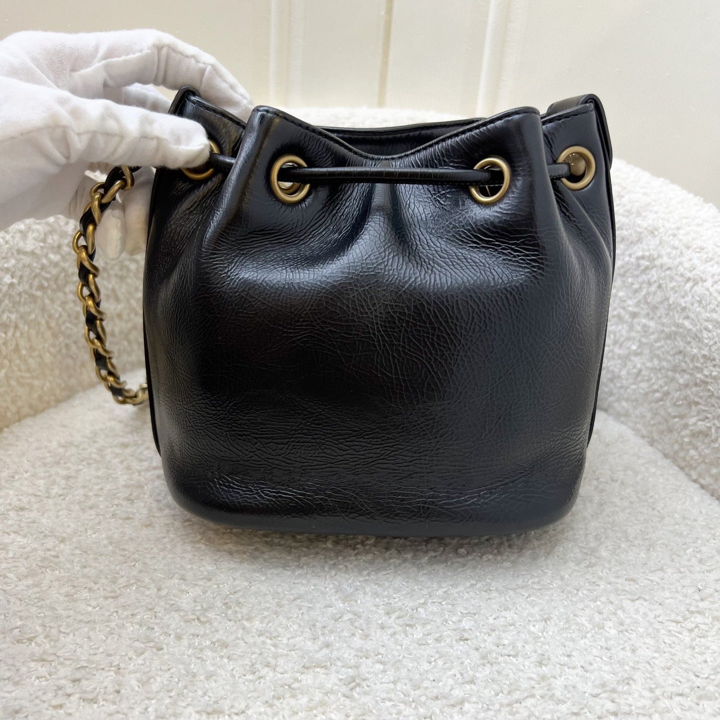 Chanel Mini Drawstring Bucket Bag In Glossy Distressed Black Calfskin And Aghw