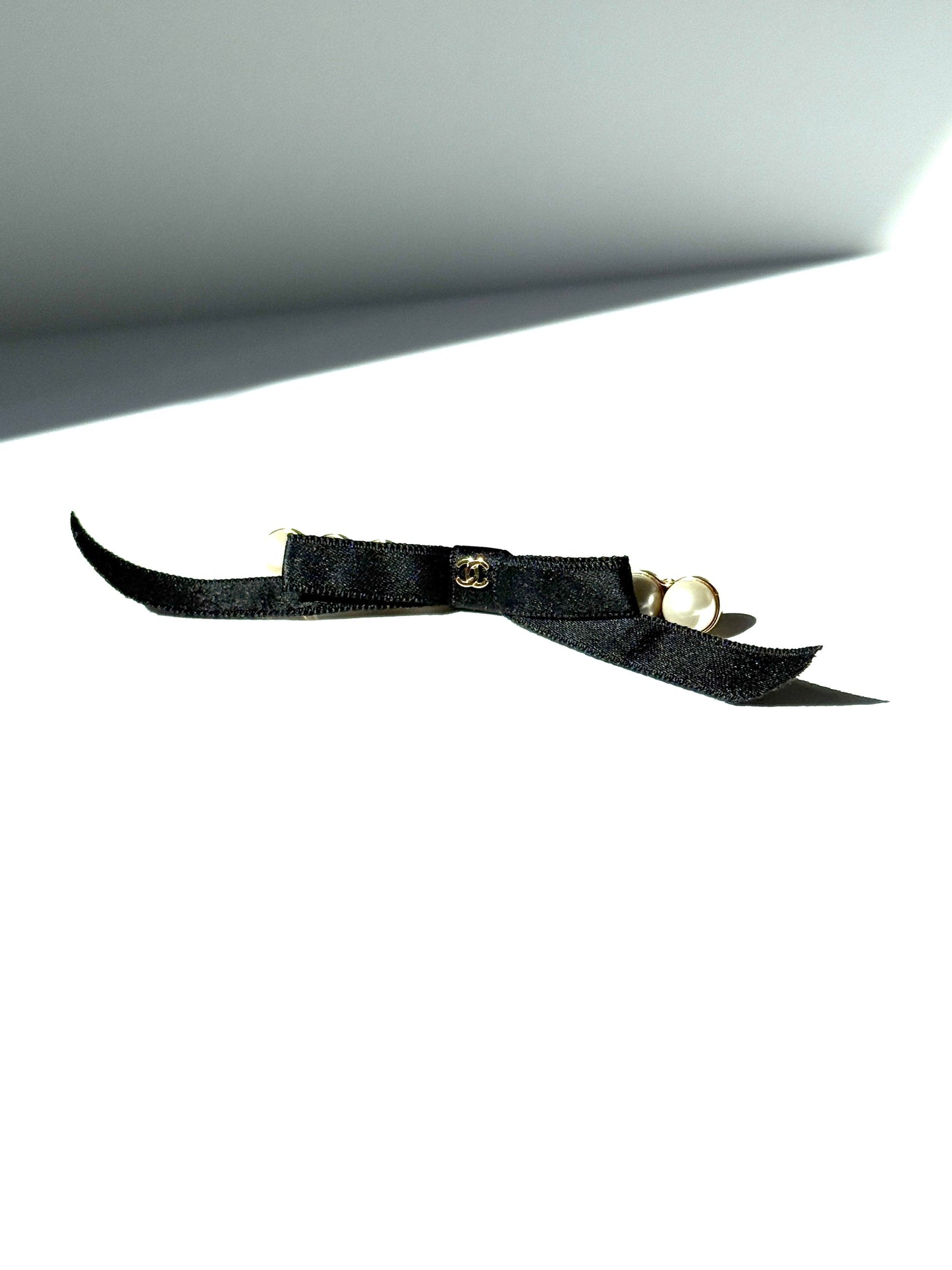 Chanel Black Faux Pearl Bow CC Logo 2025 Gold Hardware Hair Barrette Clip Handbag