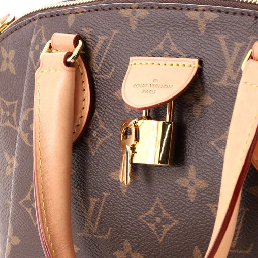Louis Vuitton RIVOLI PM Monogram Handbag
