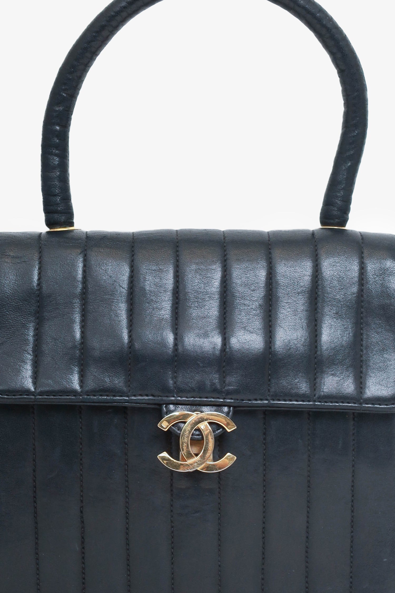 Chaneltm 1991 94 Black Vertical Quilted Lambskin Top Handle Bag