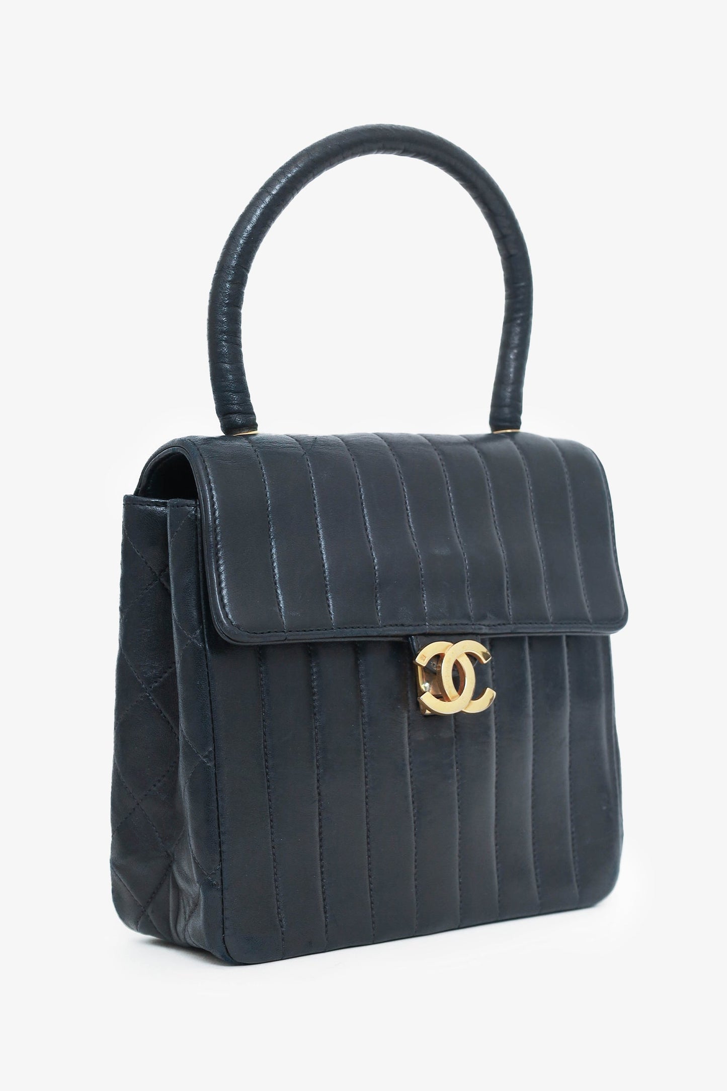 Chaneltm 1991 94 Black Vertical Quilted Lambskin Top Handle Bag