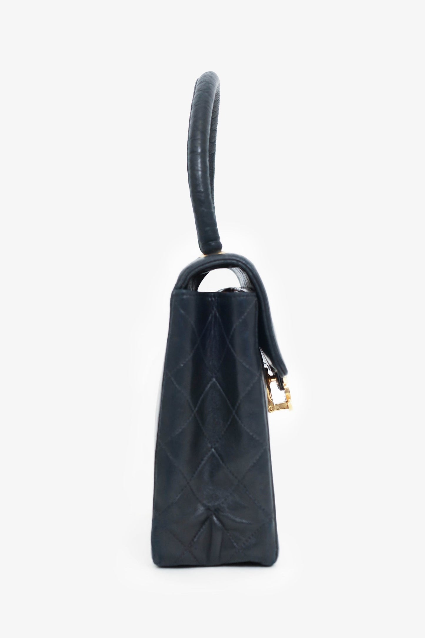 Chanel™ -94 Black Vertical Quilted Lambskin Top Handle Bag
