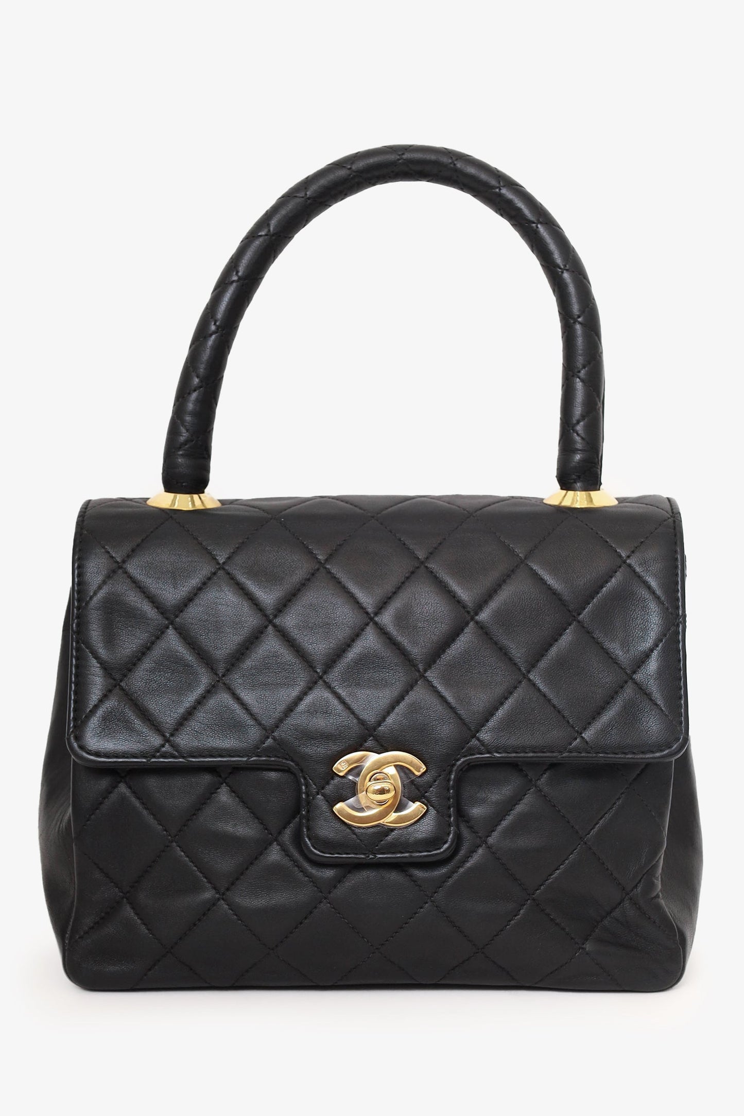 Chanel™ -94 Black Quilted Lambskin Kelly Top Handle Bag