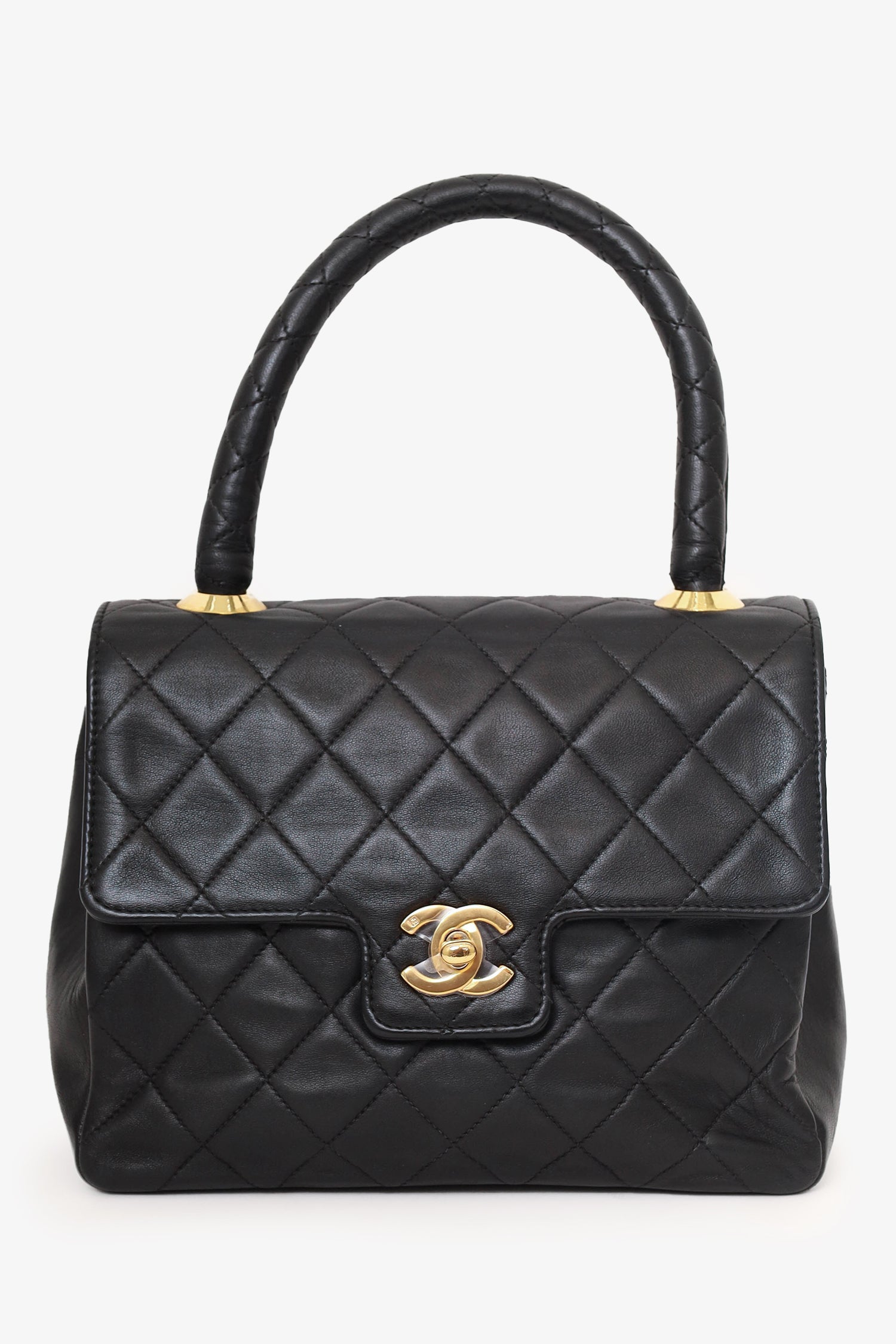Chanel™ -94 Black Quilted Lambskin Kelly Top Handle Bag