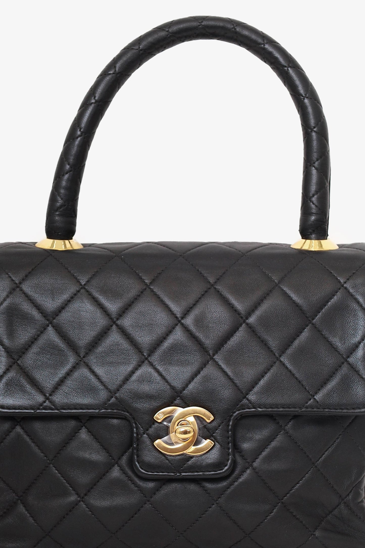Chanel™ -94 Black Quilted Lambskin Kelly Top Handle Bag