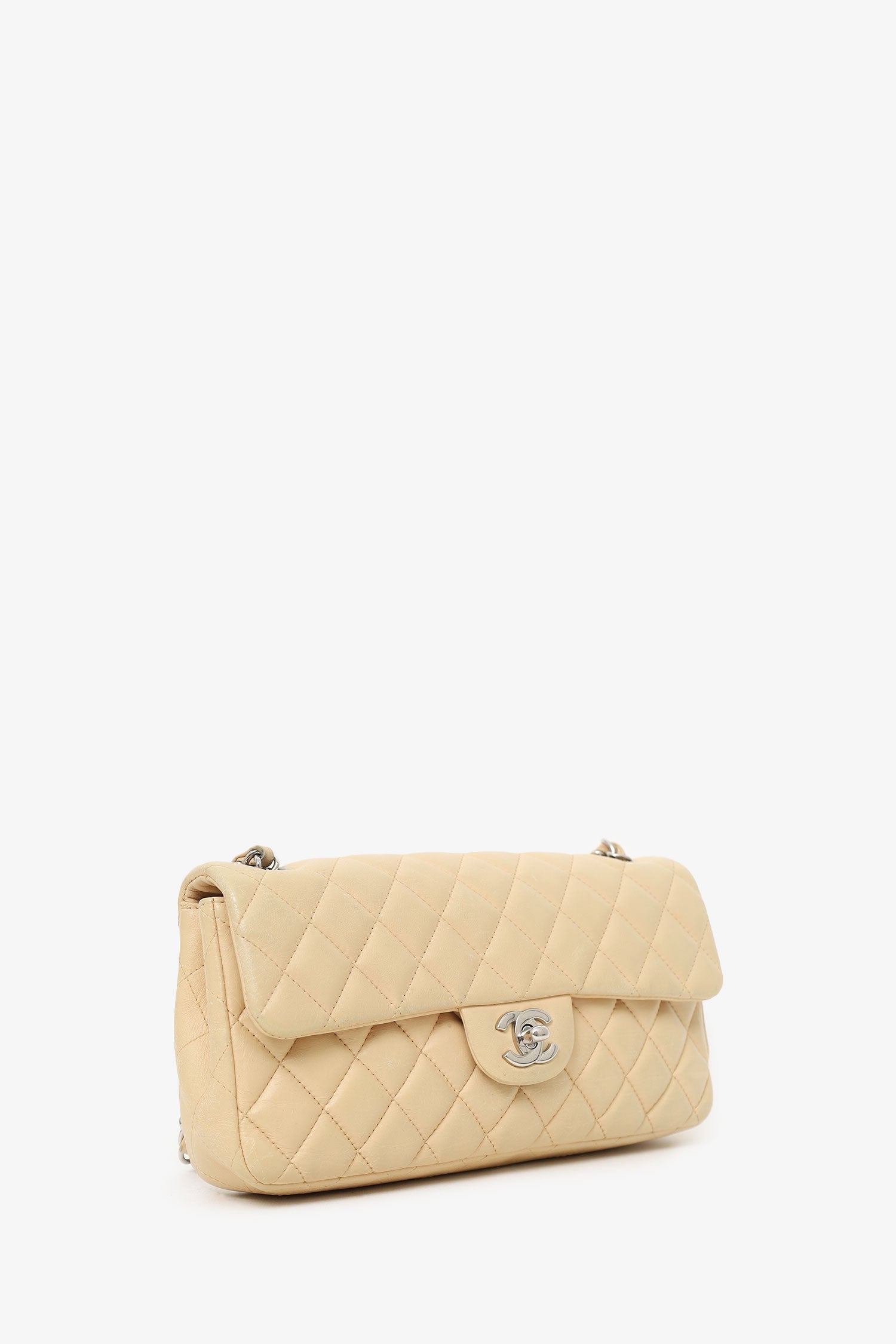 Chanel™ -11 Beige Quilted Lambskin East/West Single Flap Bag