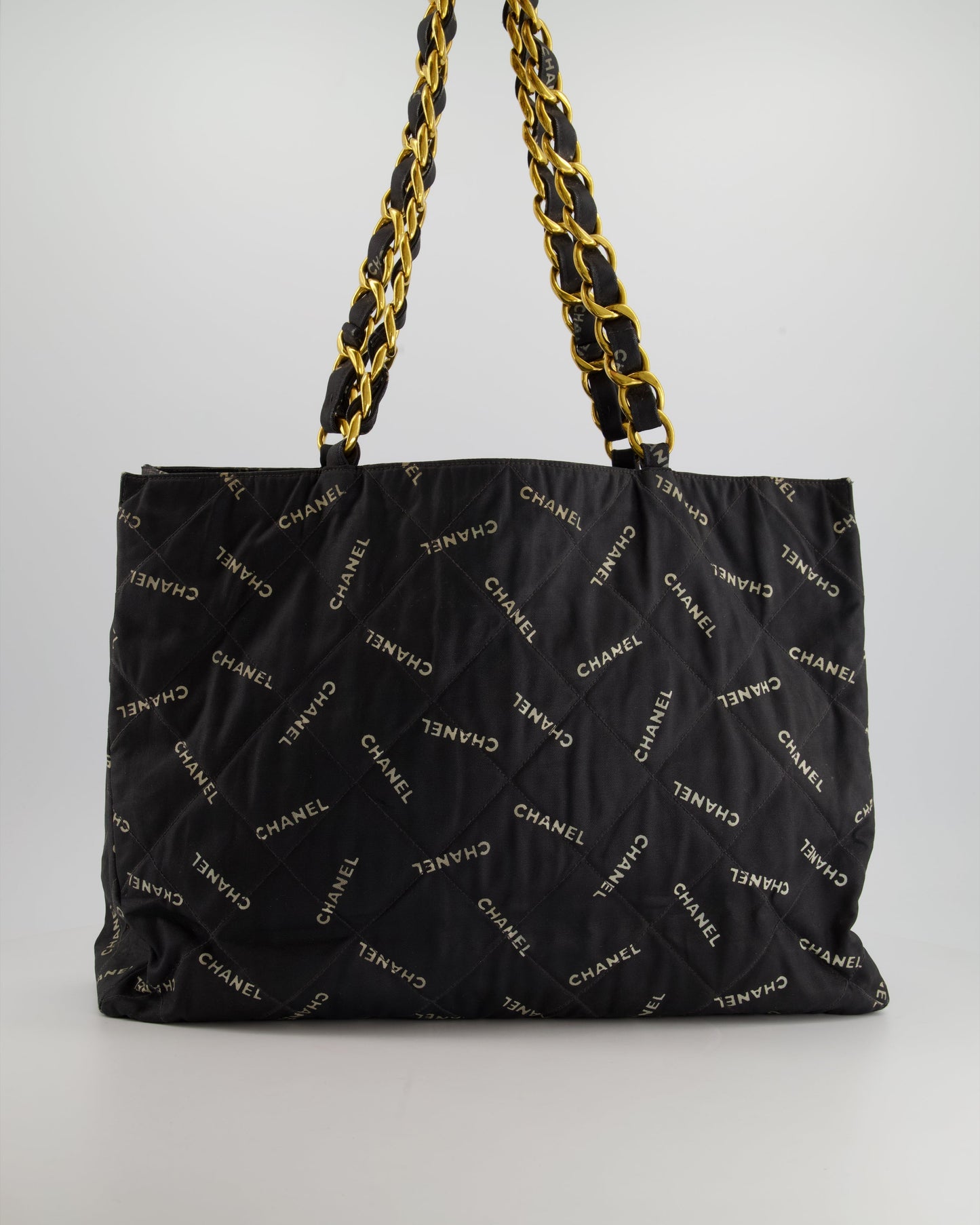 Chanel *rare* Black Bag in Quilted Canvas Logo Print with Gold Hardware