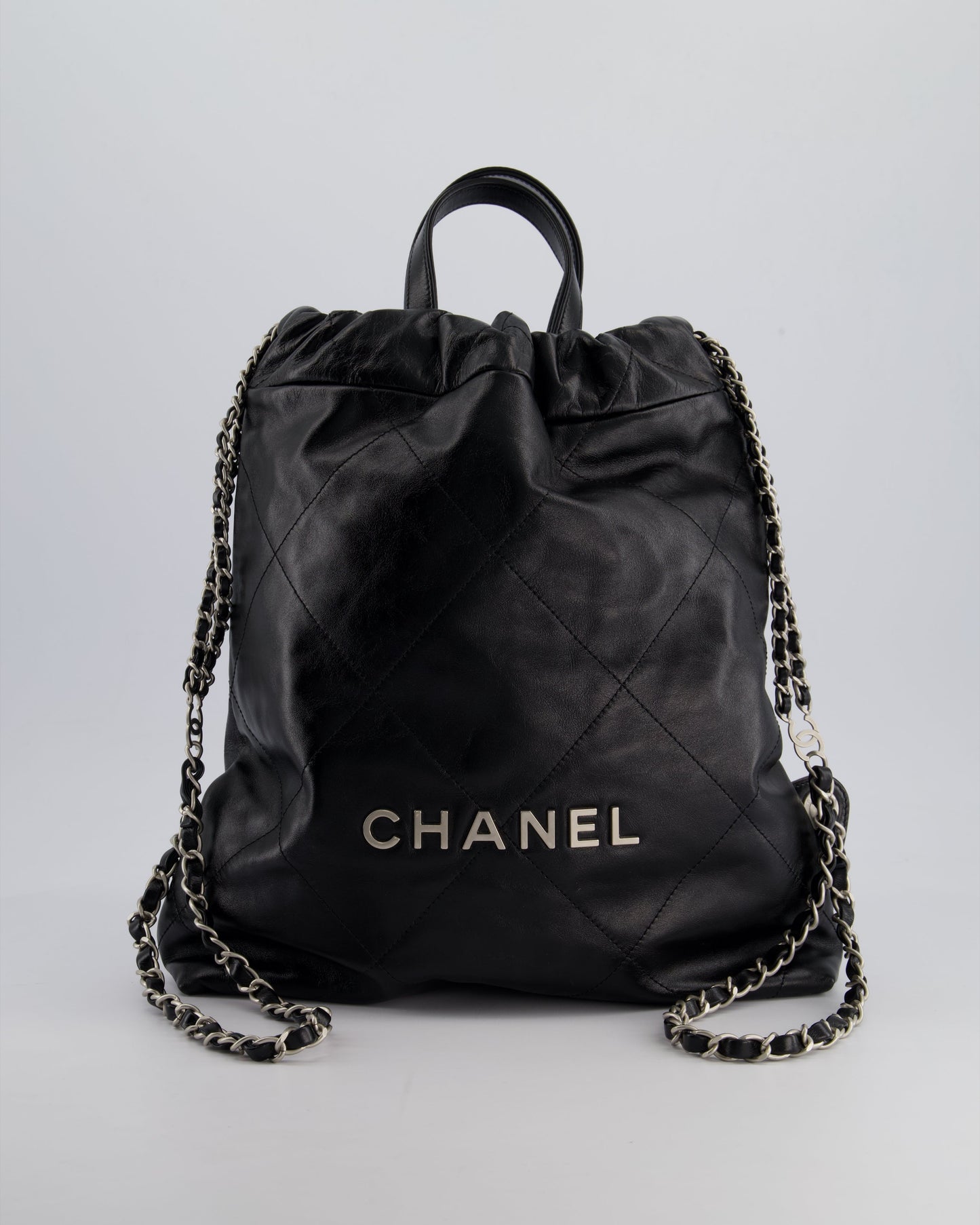 Chanel *Fire Price* 22 Small Backpack Bag In Black Shiny Calfskin With Brushed Silver Hardware