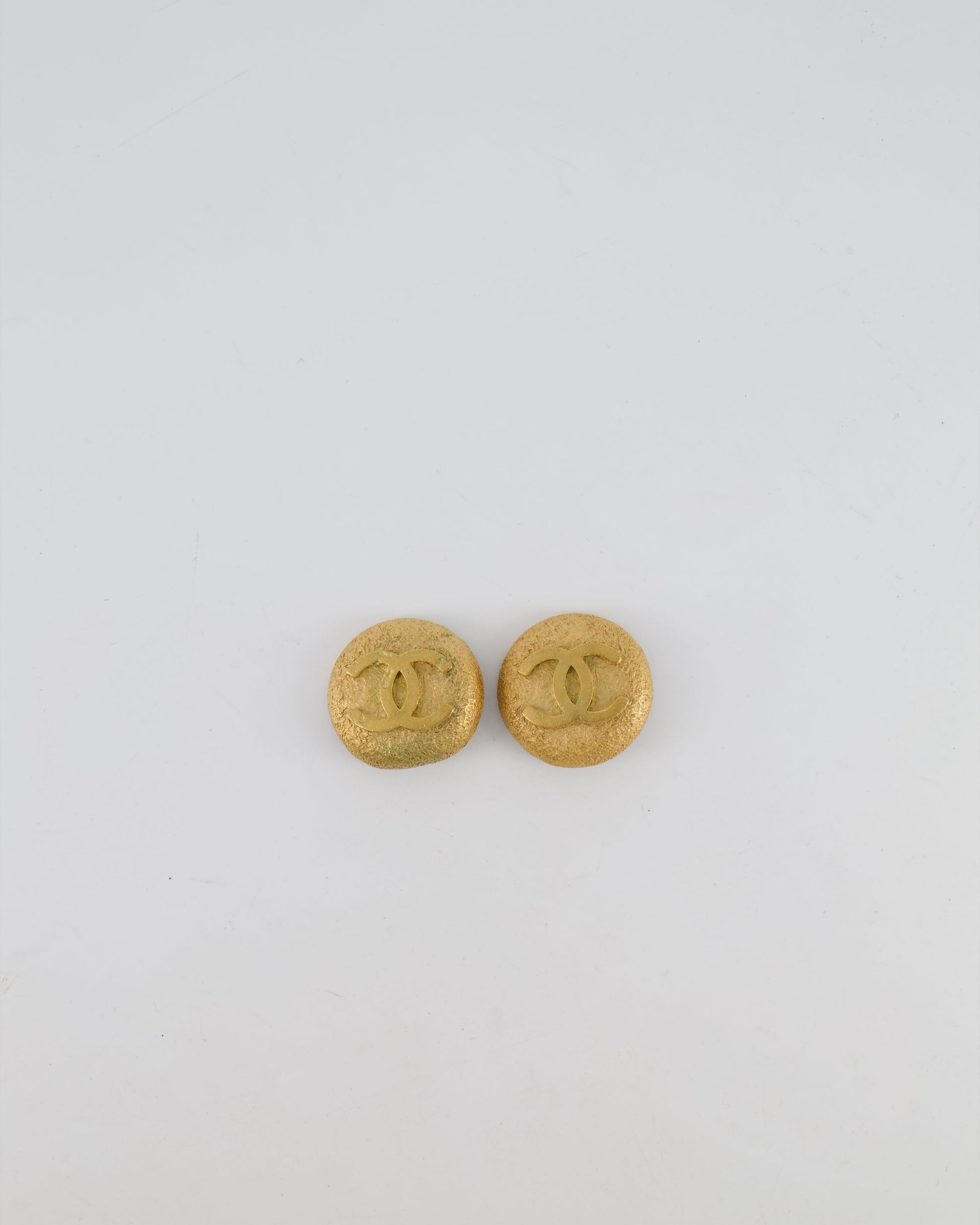 Chanel 94P Gold Textured Round Clip on Earrings with Gold CC Logo