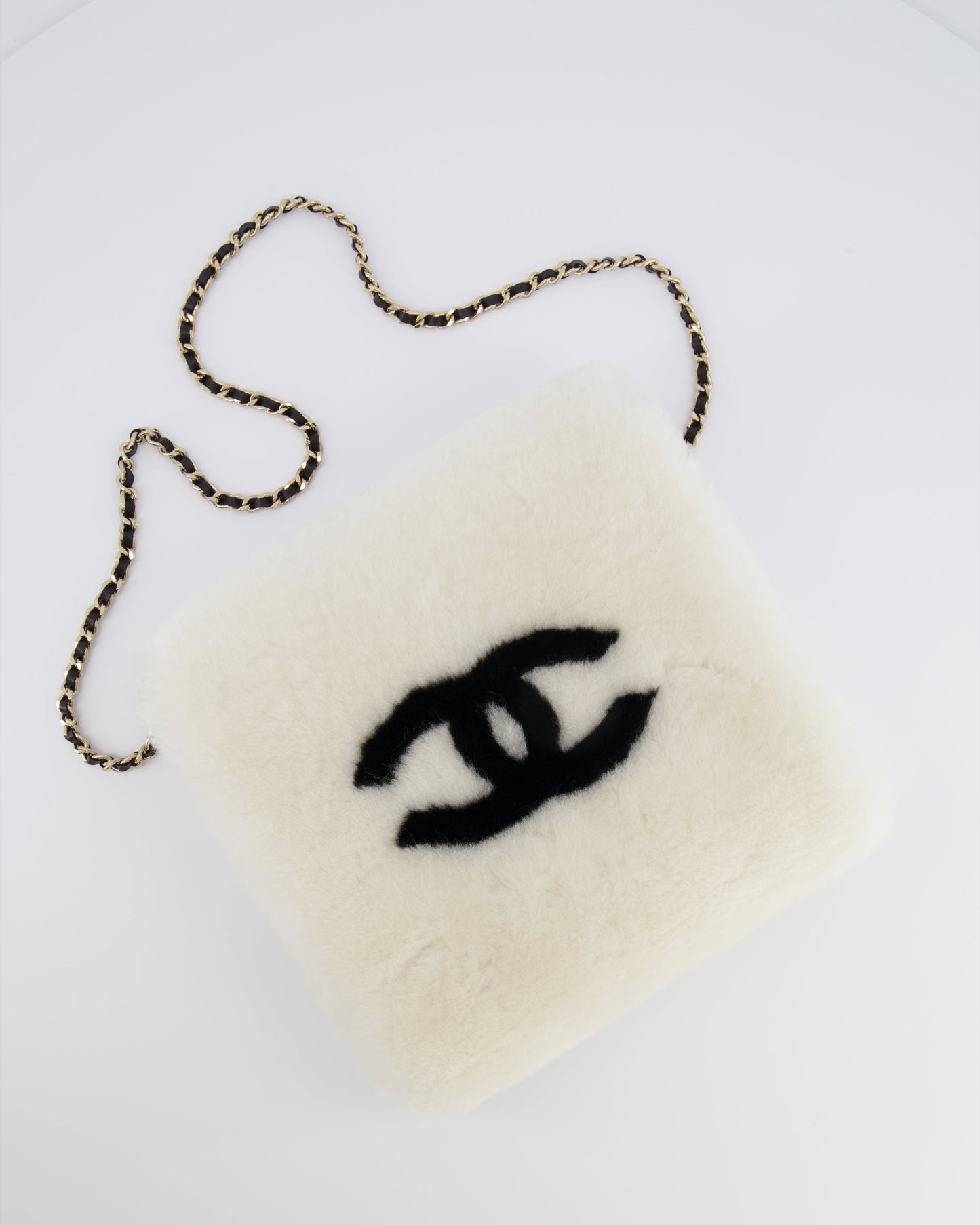Chanel *hot* Coco Neige 25/26 Ecru and Black Shearling Lambskin Muff Bag with Black CC Logo and Champagne Gold Chain Detail