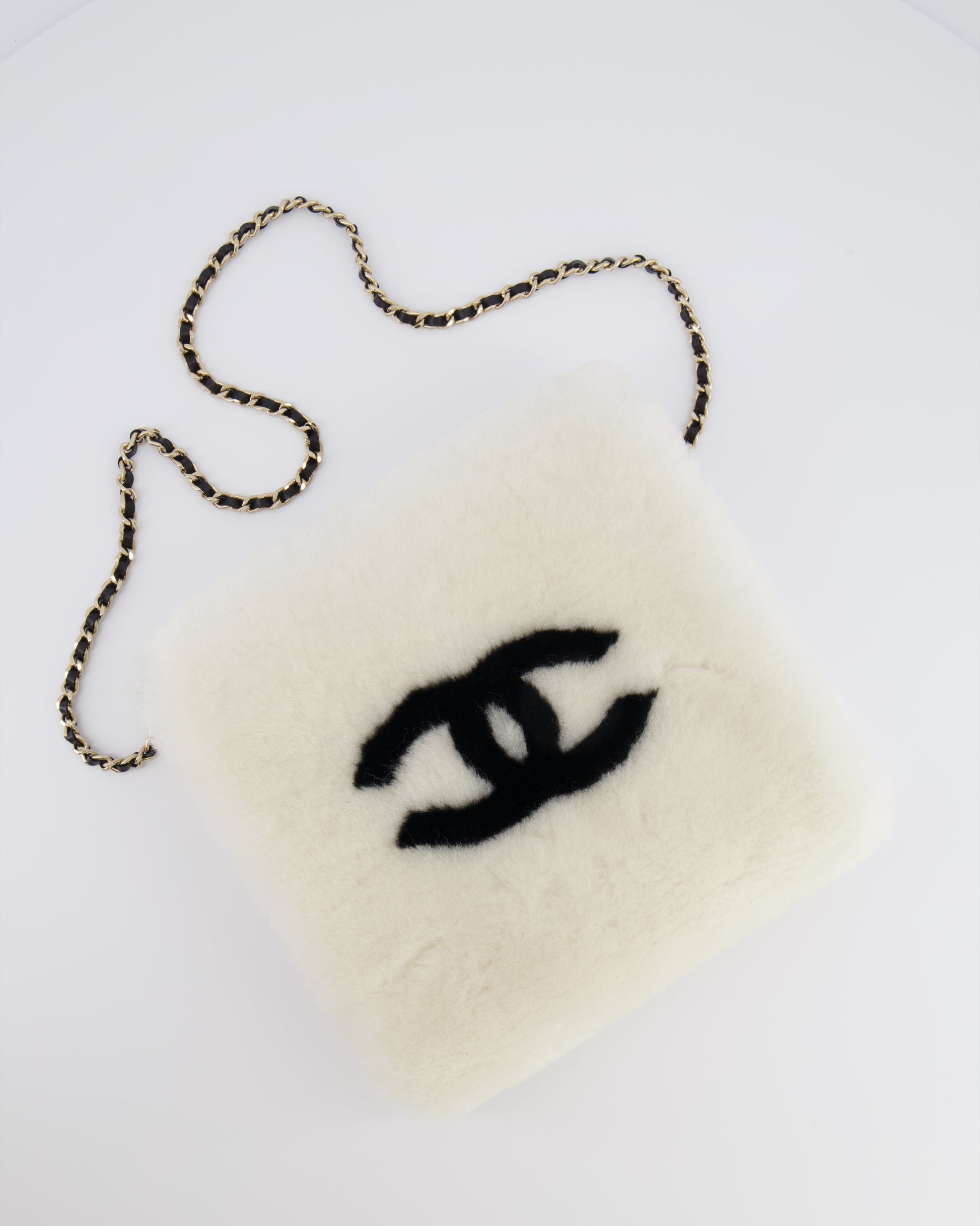 Chanel *hot* Coco Neige 25/26 Ecru and Black Shearling Lambskin Muff Bag with Black CC Logo and Champagne Gold Chain Detail