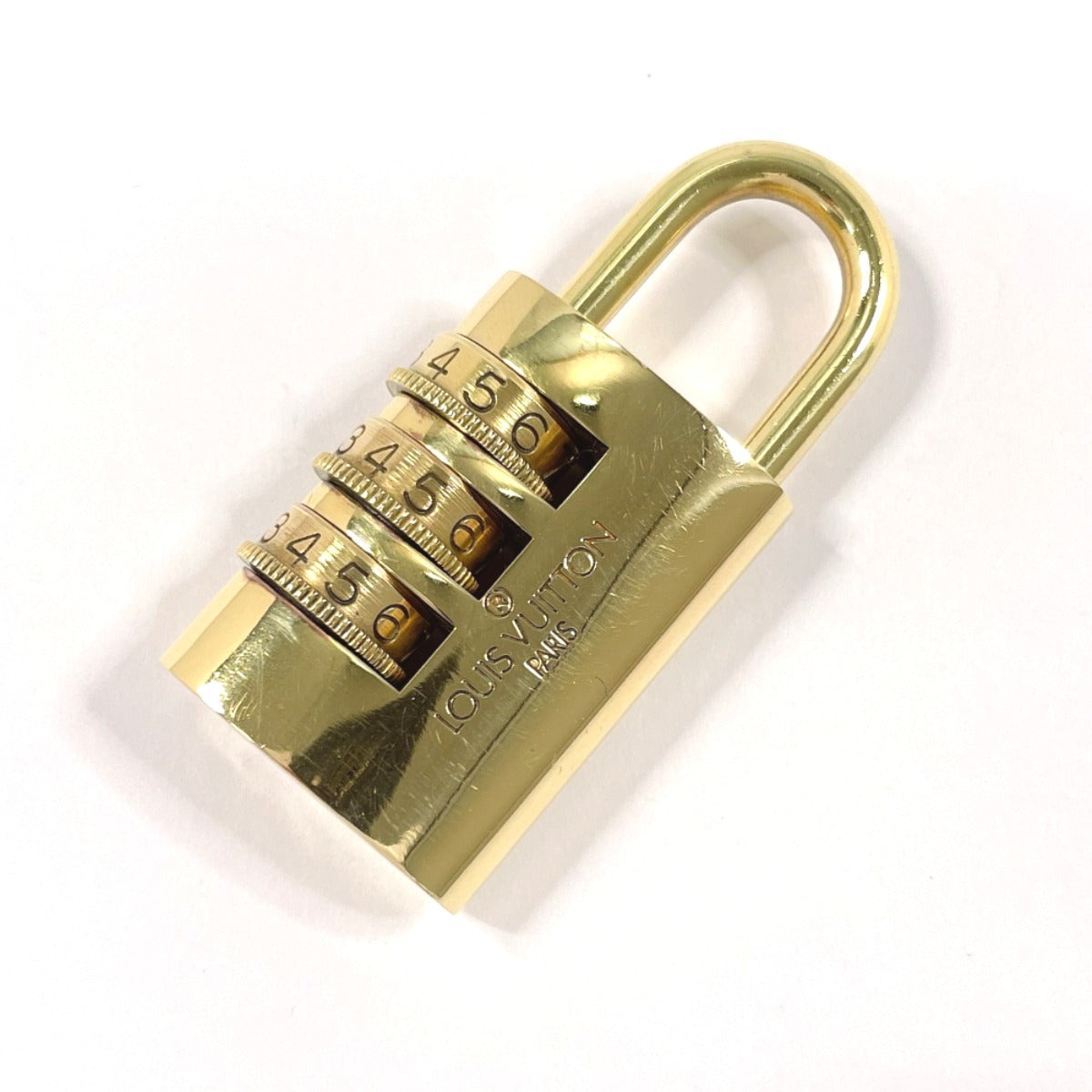 Louis Vuitton Cadena brass padlock Dial padlock Gold Handbag