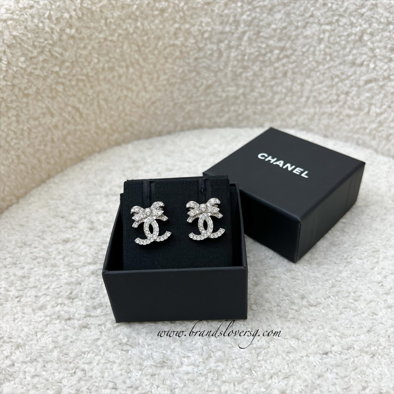 Chanel 23S Ribbon Earrings with Crystals in Shw