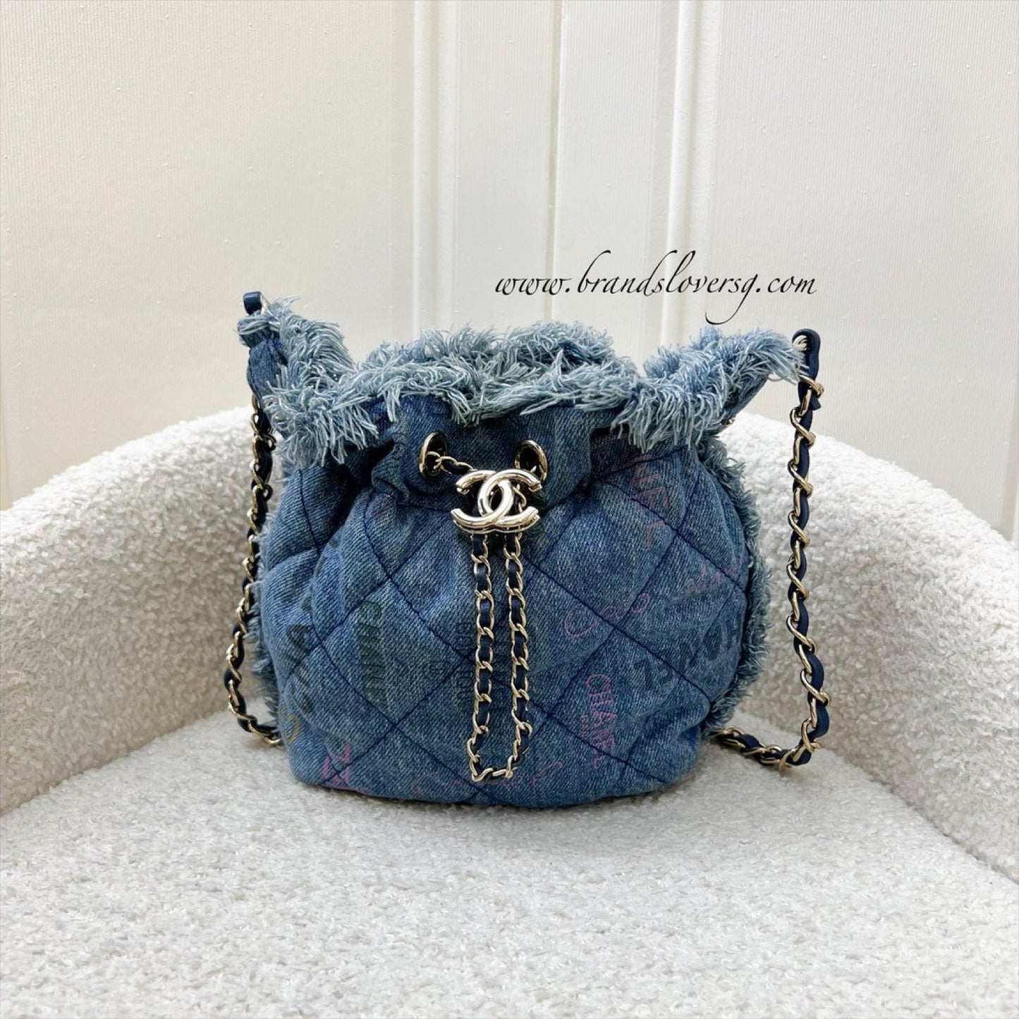 Chanel 22P Denim Mood Mini Drawstring Bucket Bag in Blue Printed Denim and LGHW
