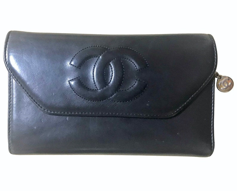Chanel   black leather wallet with large CC stitch mark