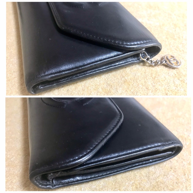 Chanel   black leather wallet with large CC stitch mark