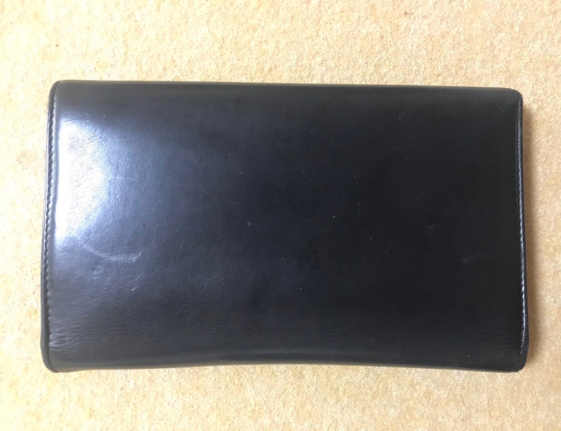Chanel   black leather wallet with large CC stitch mark