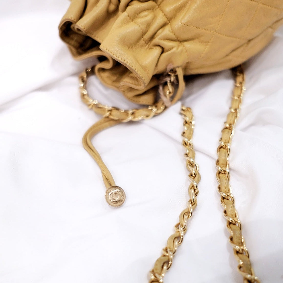 Chanel quilted drawstring chain bag