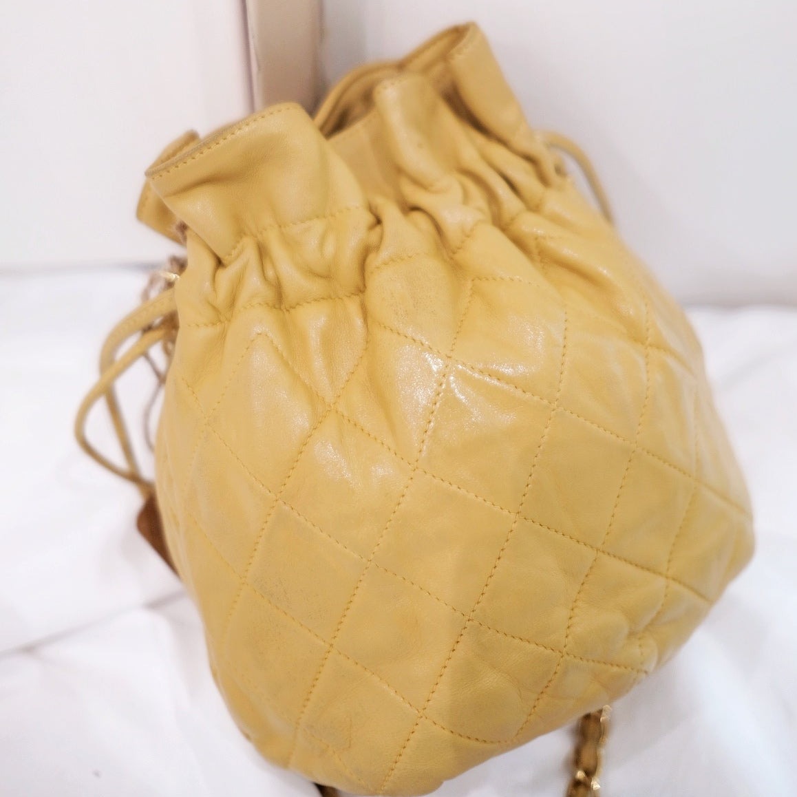 Chanel quilted drawstring chain bag