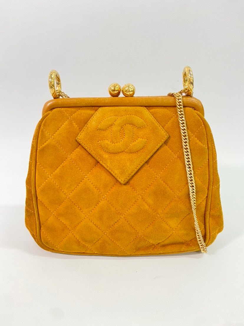 CHANEL   Quilted Suede Chain Top Handle Bag Mustard