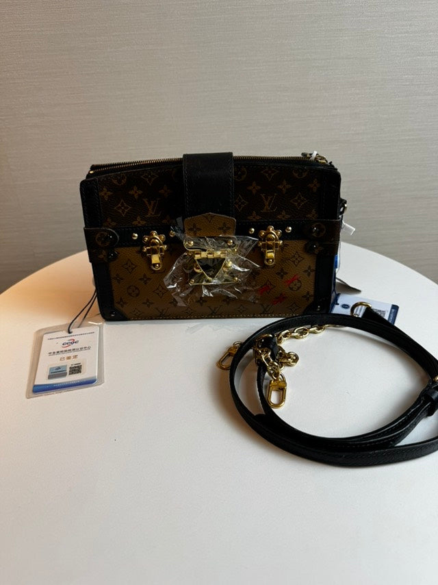Louis Vuitton Petite Malle Monogram Canvas Top Handle Bag in Brown
