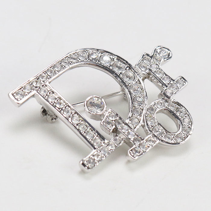 Dior Brooch Other Accessories Metal,Rhinestone Women Handbag Silver Logo Travel Bag